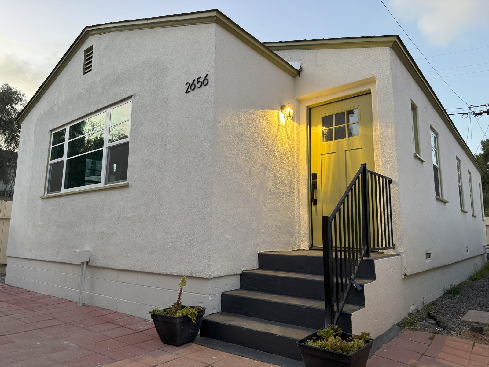 2656 F Street front with yellow door and porch light