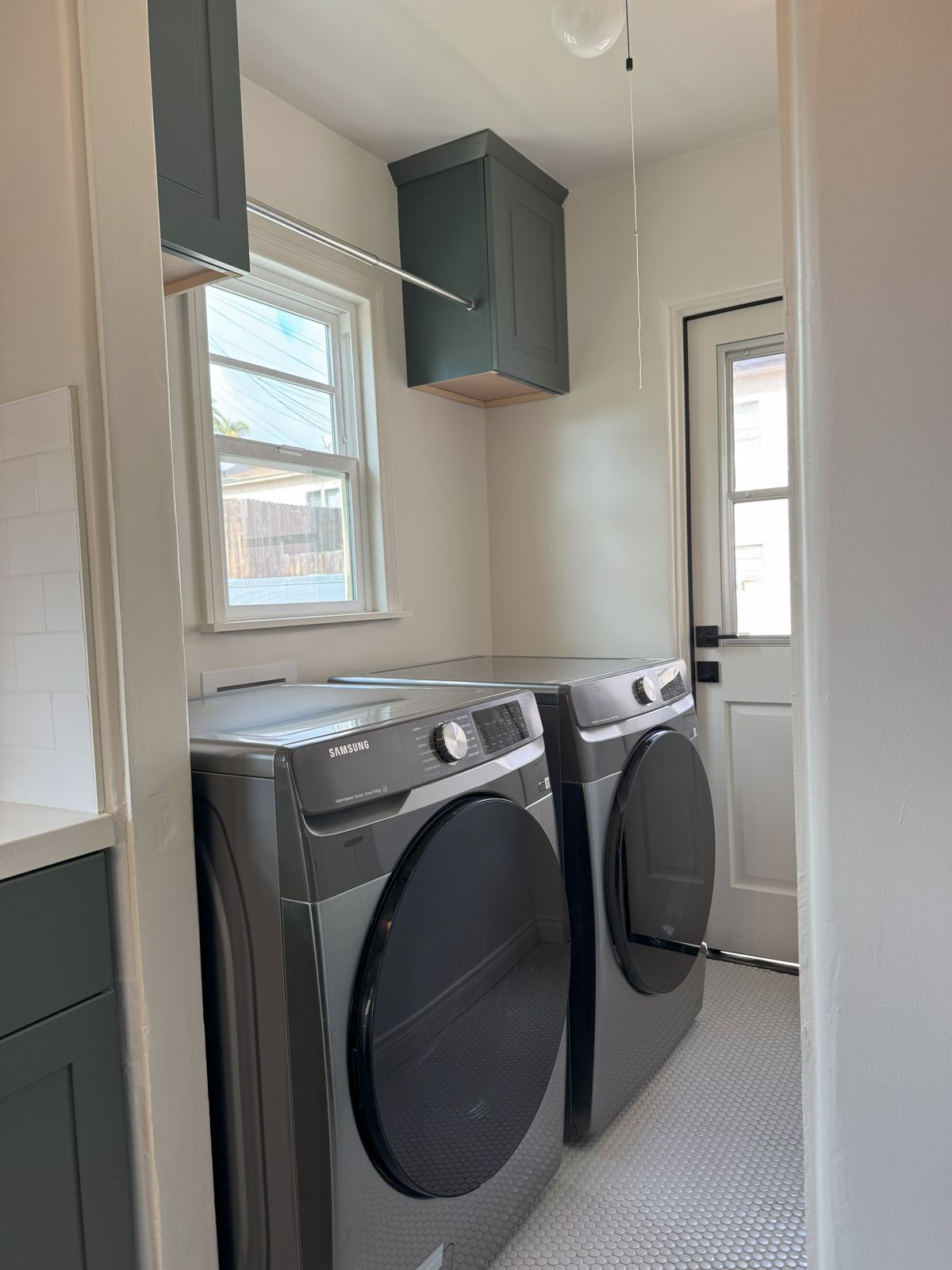 Laundry room with front-load washer and dryer